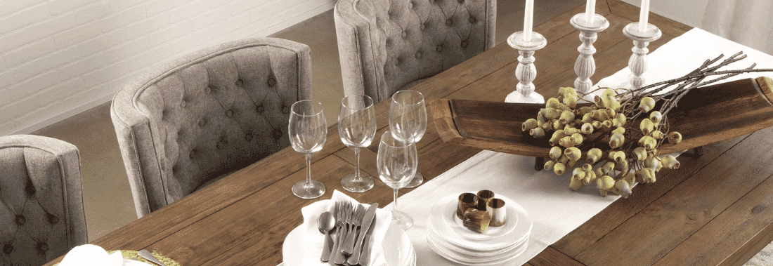 table setting with wine glasses and serving tray