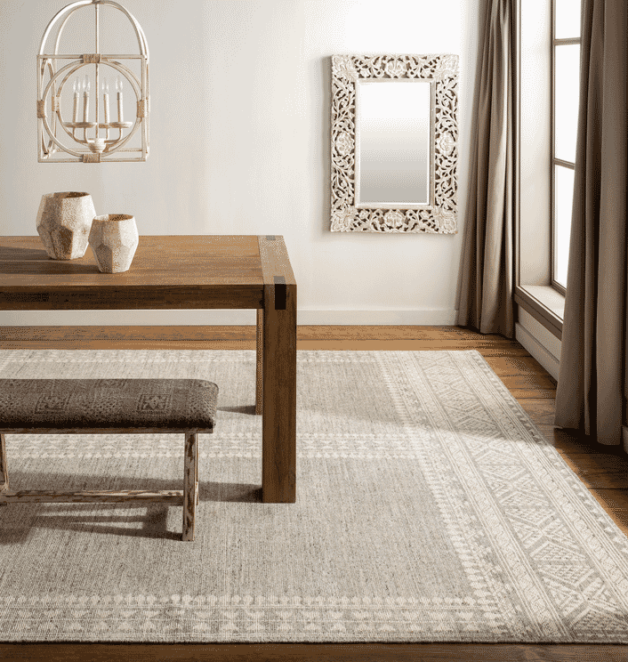 picture of modern dining room with a neutral area rug