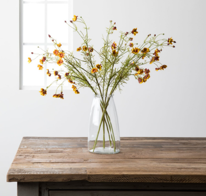 clear glass vase with yellow flowers