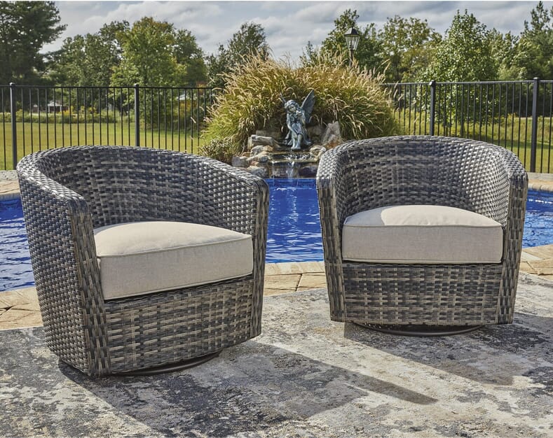 Blue Sky S/2 outdoor swivel chair with resin wicker and an upholstered cushion in a neutral tone