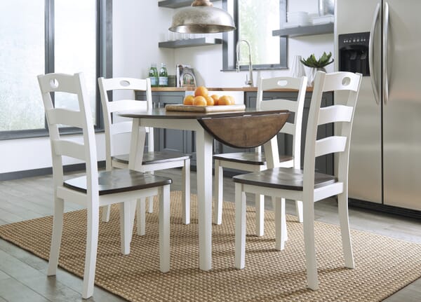 white 5 piece dining set with dropleaf table down in room shot