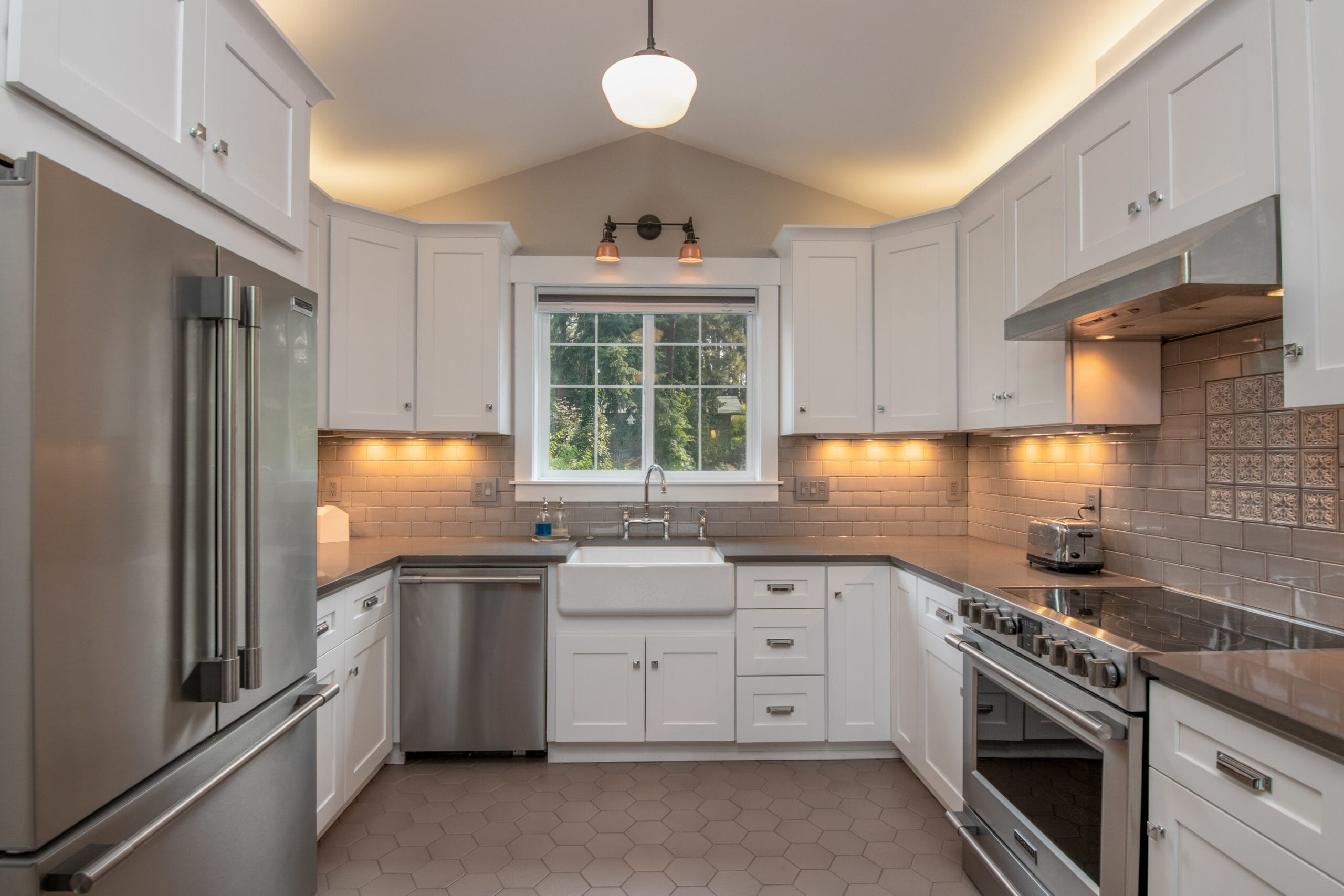 Kitchen with white cabinets and stainless steel appliances