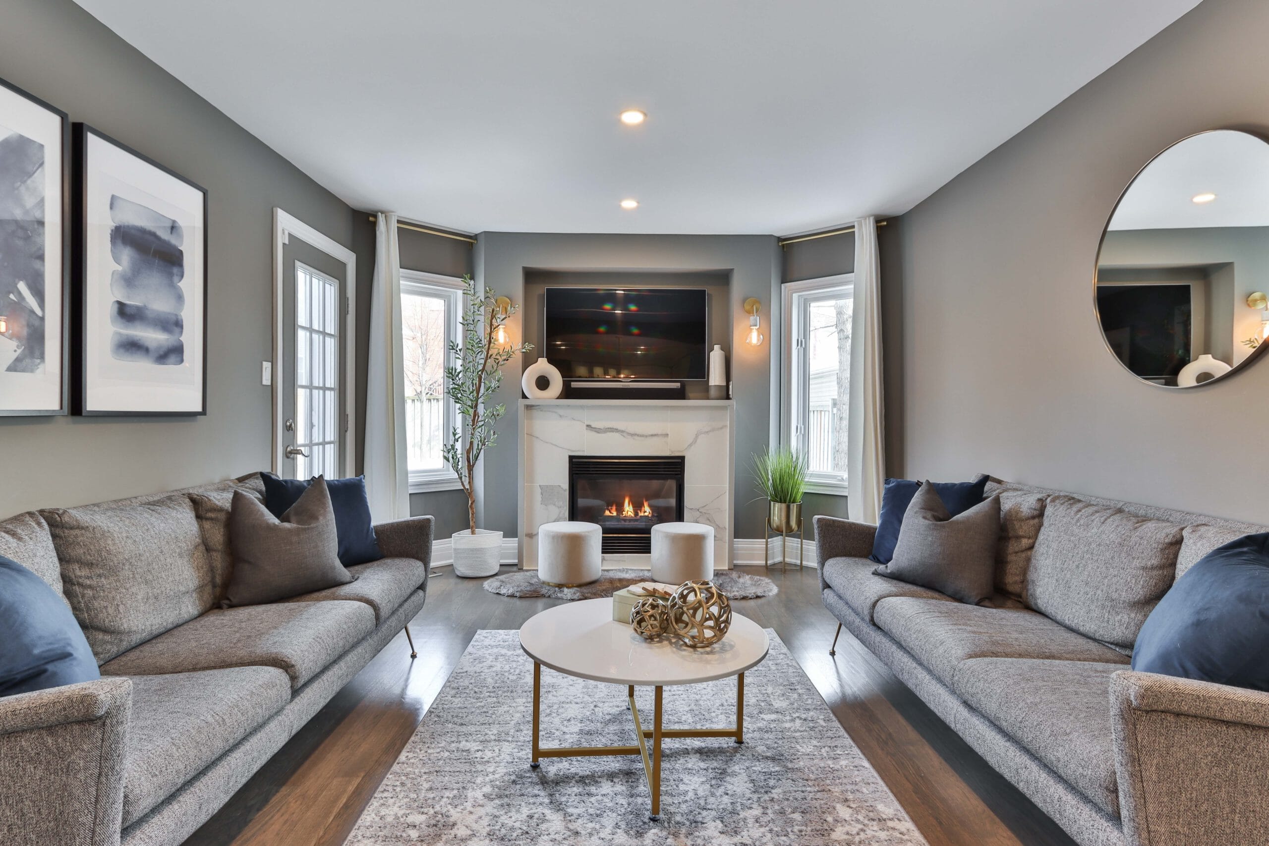 Living Room with gray sofas facing one another 