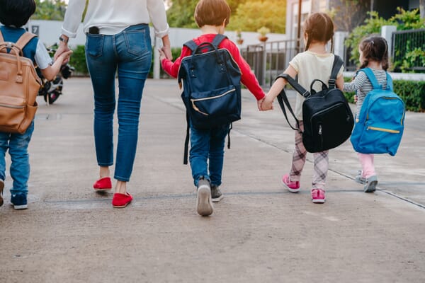 kids walking to school with backpacks