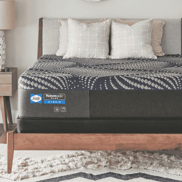 Sealy Posterpedic Plus Hybrid Mattress on a modern bedframe with throw pillows